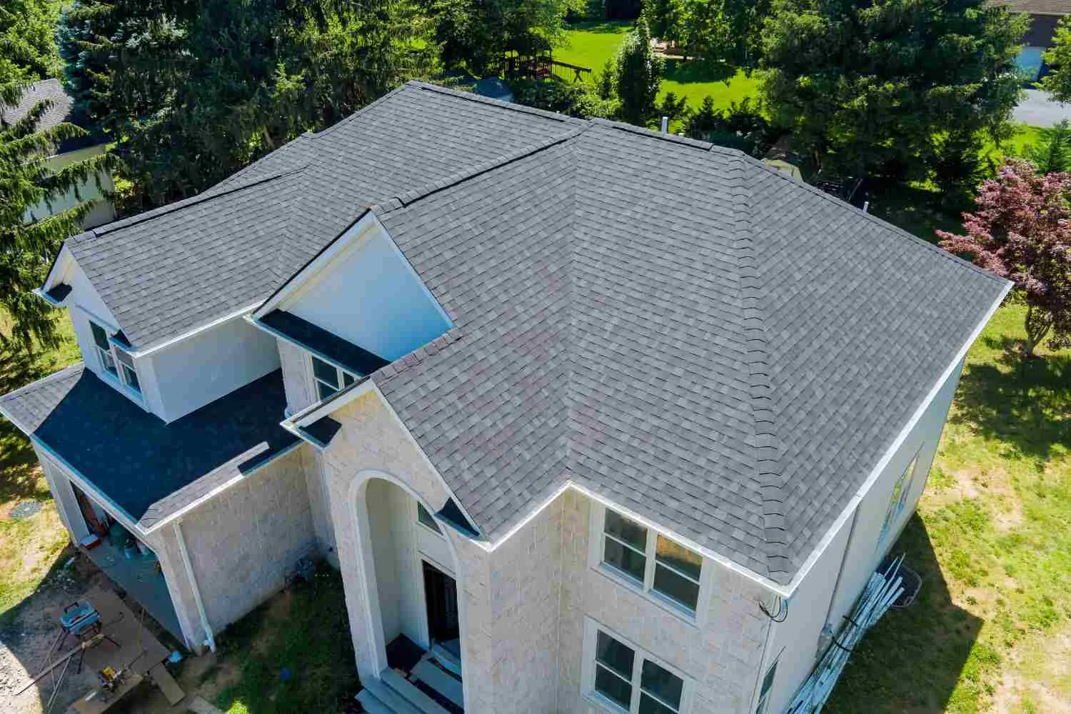 Grey shingle roof on a two-storey house seen from above